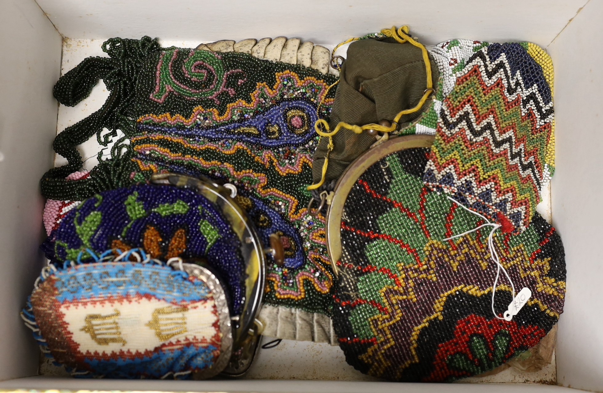 A collection of beadwork purses and bags from early 1900’s, including a W W I bead-worked purse dated 1916 with a steel frame surmounted with a building as the clasp, three beadwork bible bags, five beadwork purses and a